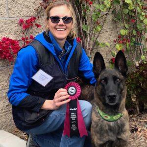 happy woman and scentwork dog winners